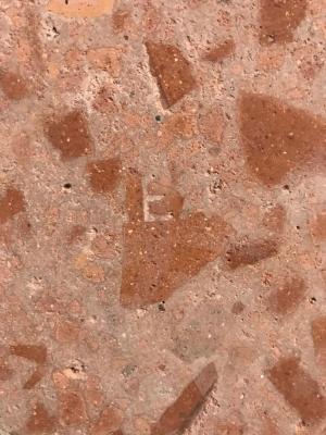 Cocciopesto floor made from old crushed roof tiles and an E from Dreadnought logo